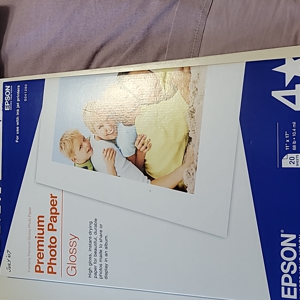 Brand new, never opened. Epson Premium Glossy Paper, premium photo paper pack